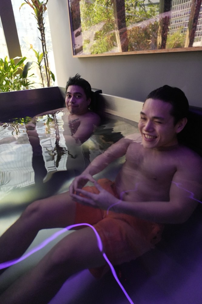 Two guests laughing in the Thermal Life cold plunge